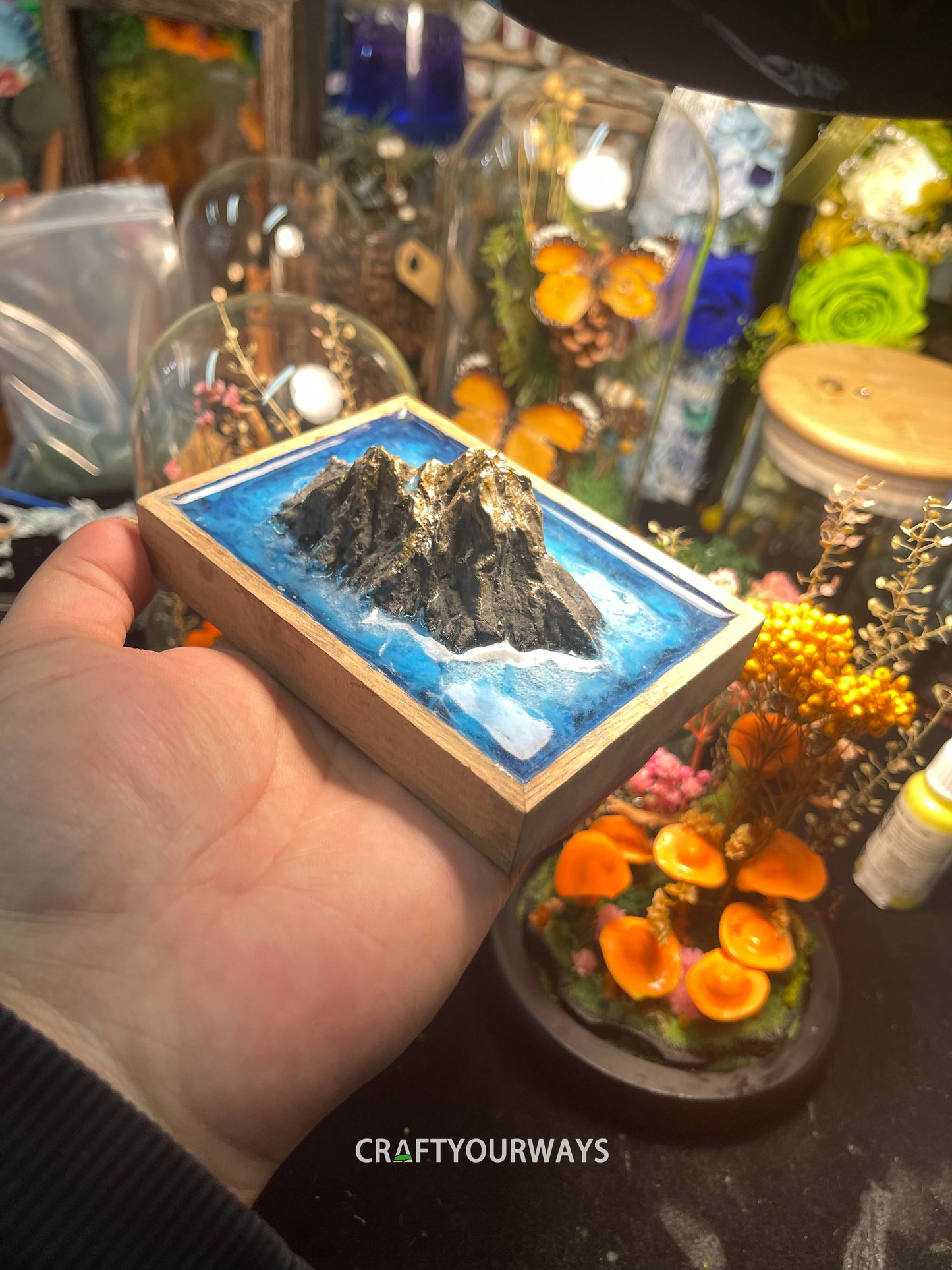 Miniature Mountain Island Scene with Snow-Capped Peak