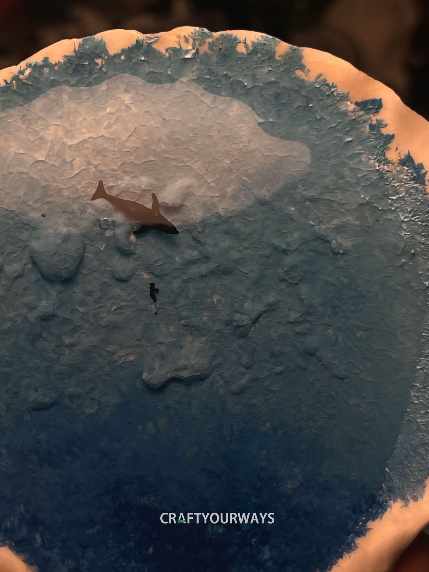 Miniature Whale Swimming in Ocean Inside Scallop Shell