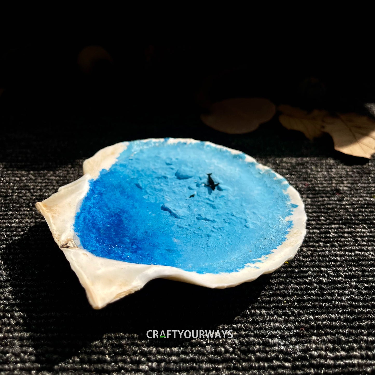 Miniature Whale Swimming in Ocean Inside Scallop Shell