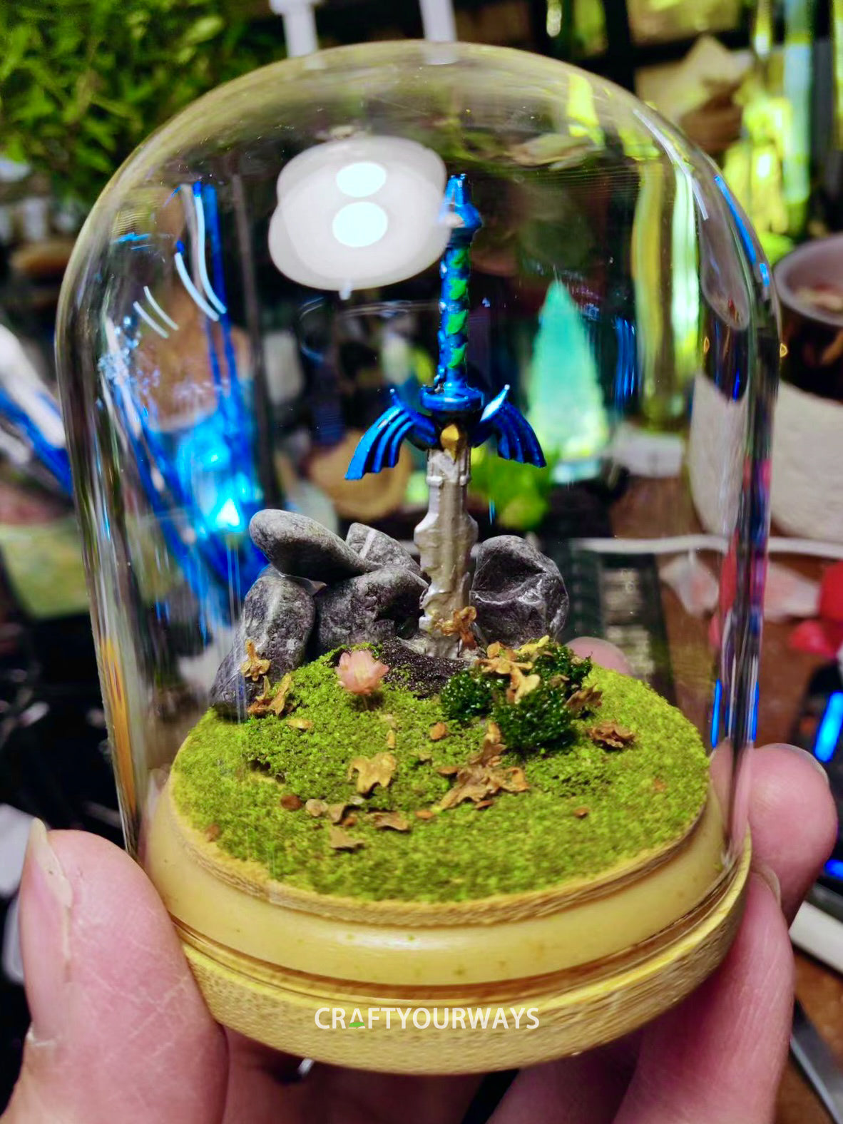 Miniature Scene of a Sword Stuck in Grass