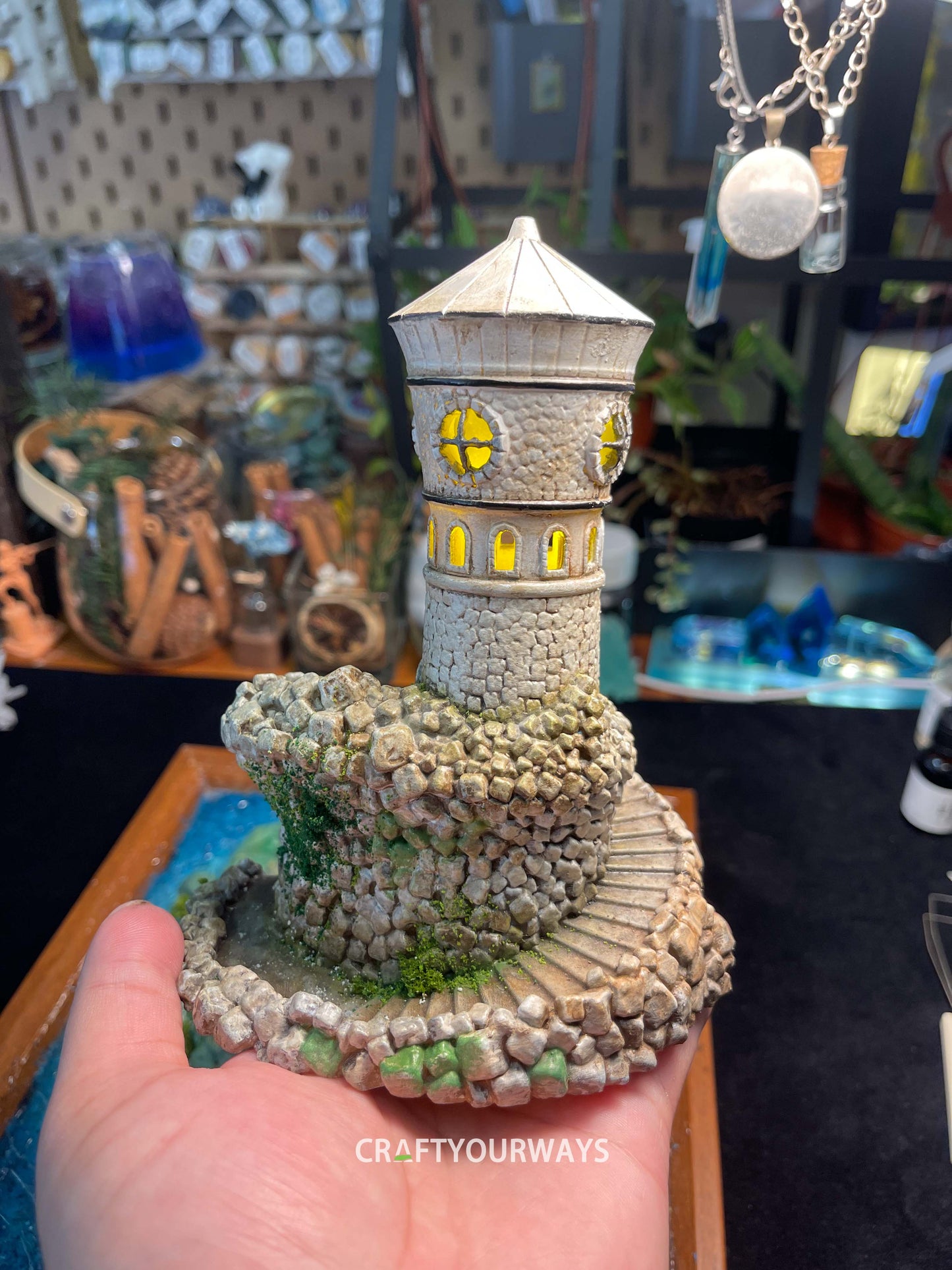 Miniature Stone Lighthouse with Rotating Steps and Illuminated Interior