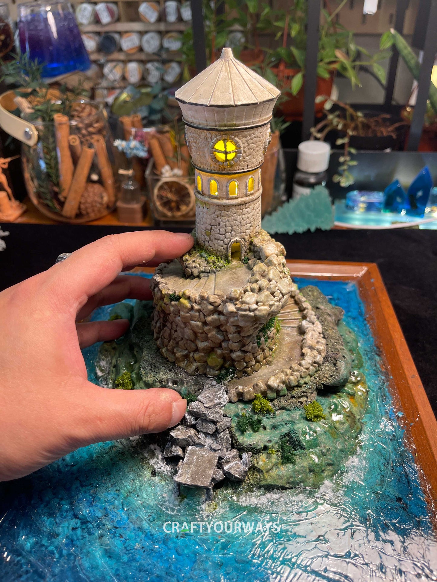 Miniature Stone Lighthouse with Rotating Steps and Illuminated Interior