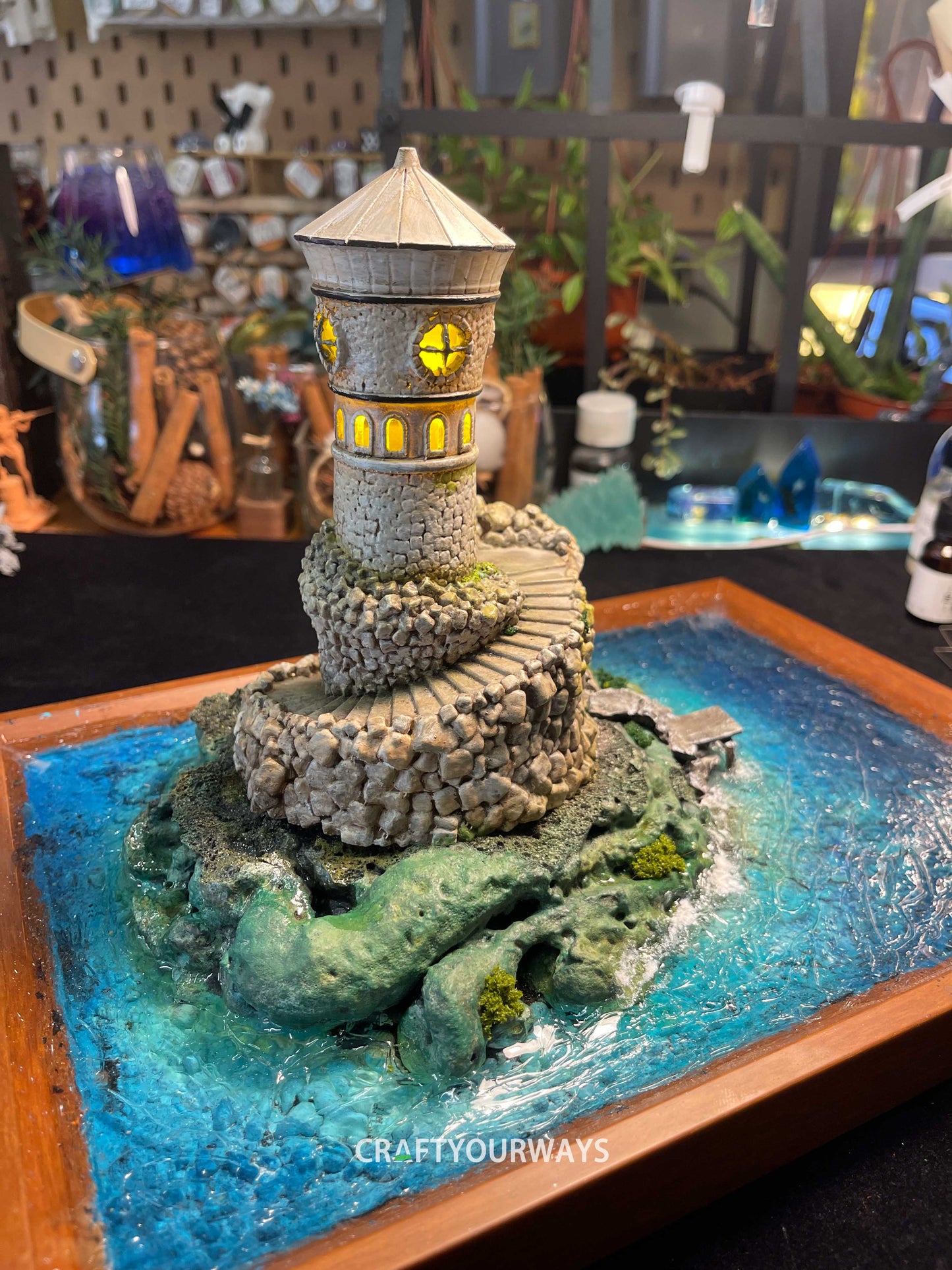 Miniature Stone Lighthouse with Rotating Steps and Illuminated Interior