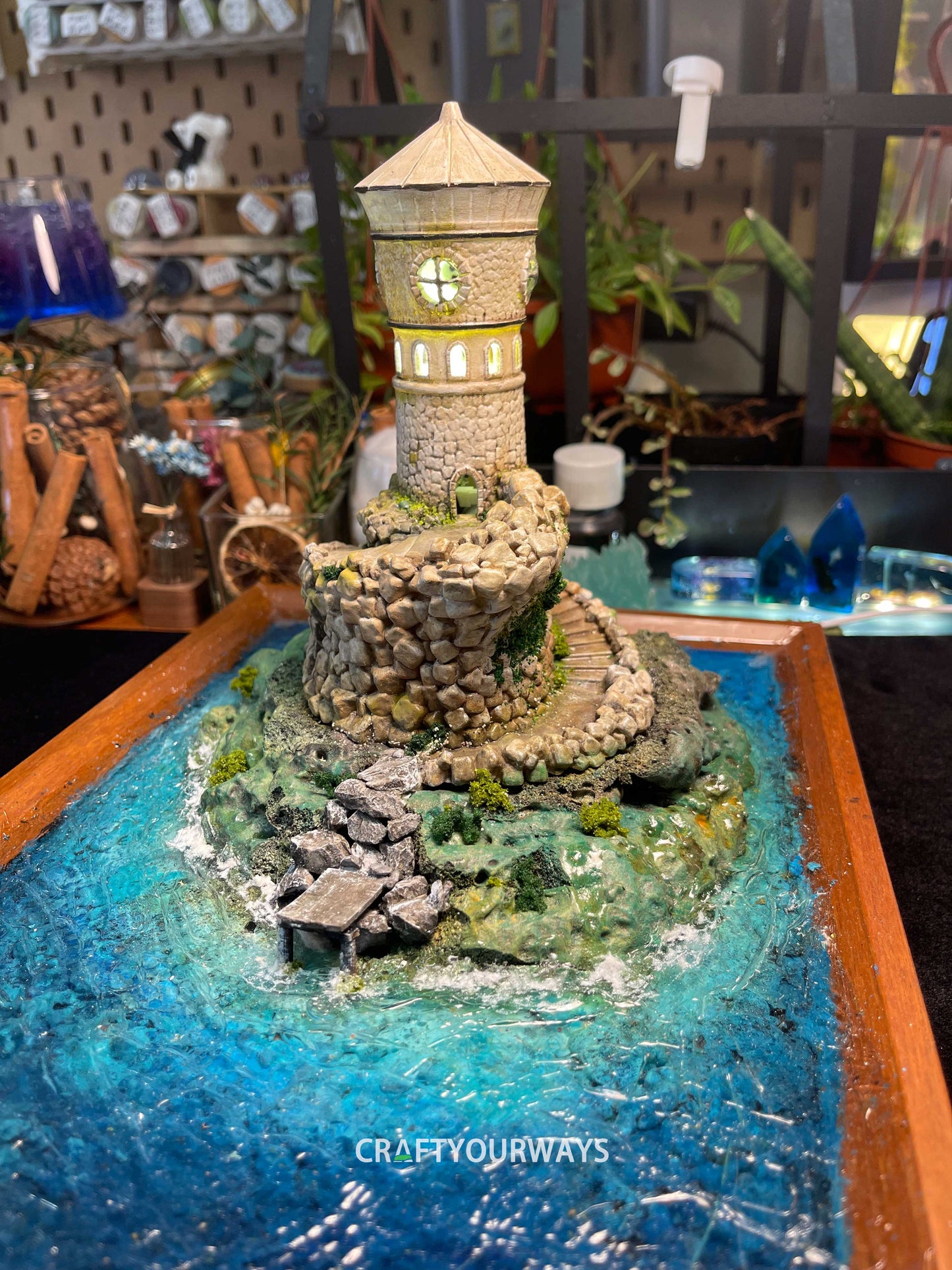 Miniature Stone Lighthouse with Rotating Steps and Illuminated Interior