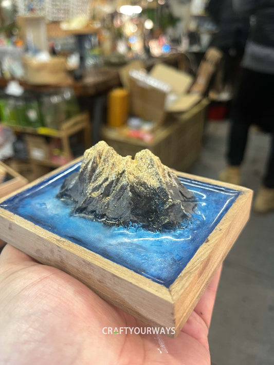 Miniature Mountain Island Scene with Snow-Capped Peak