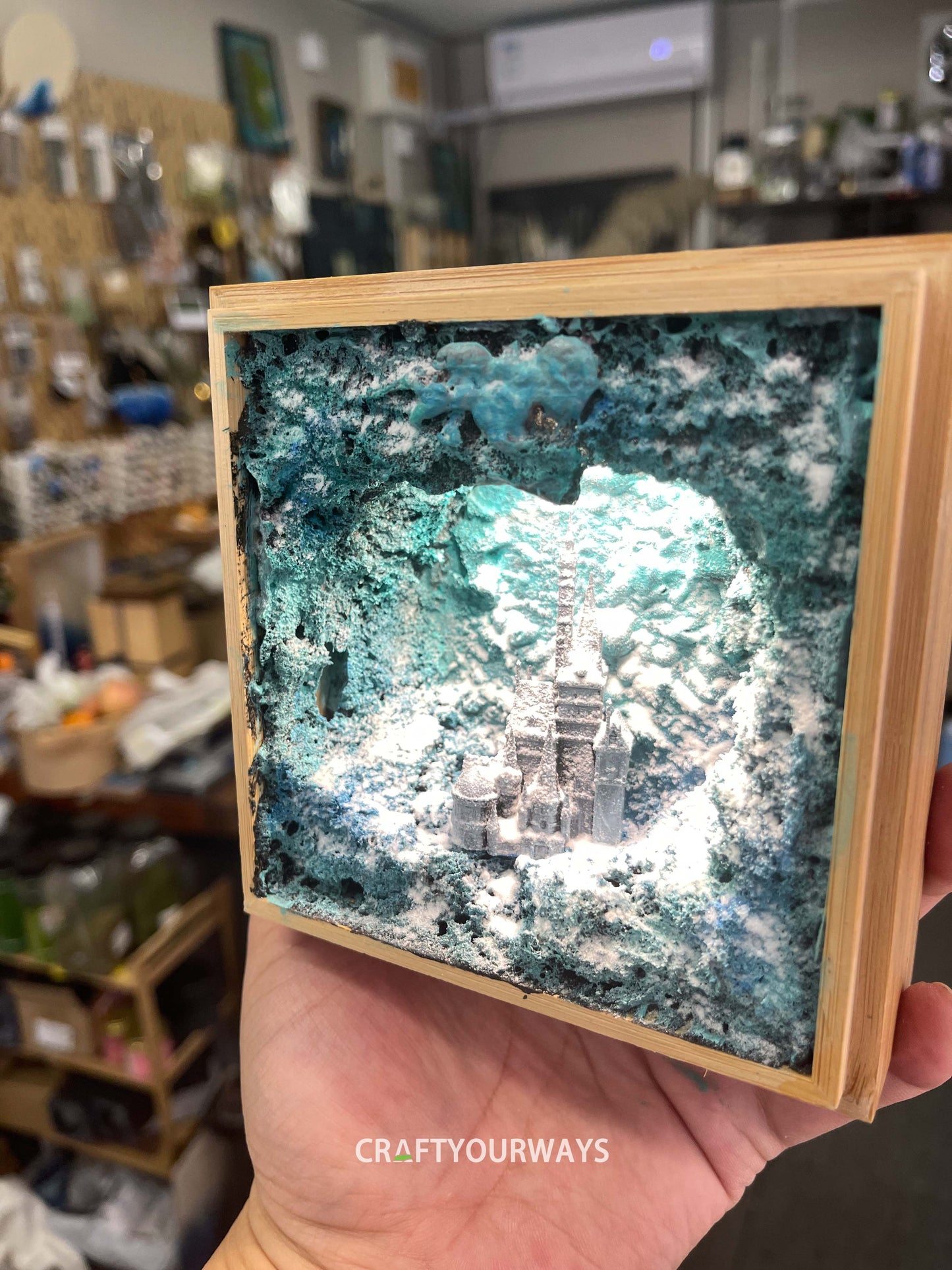 Miniature Castle in Snowy Cave with Illuminated Interior