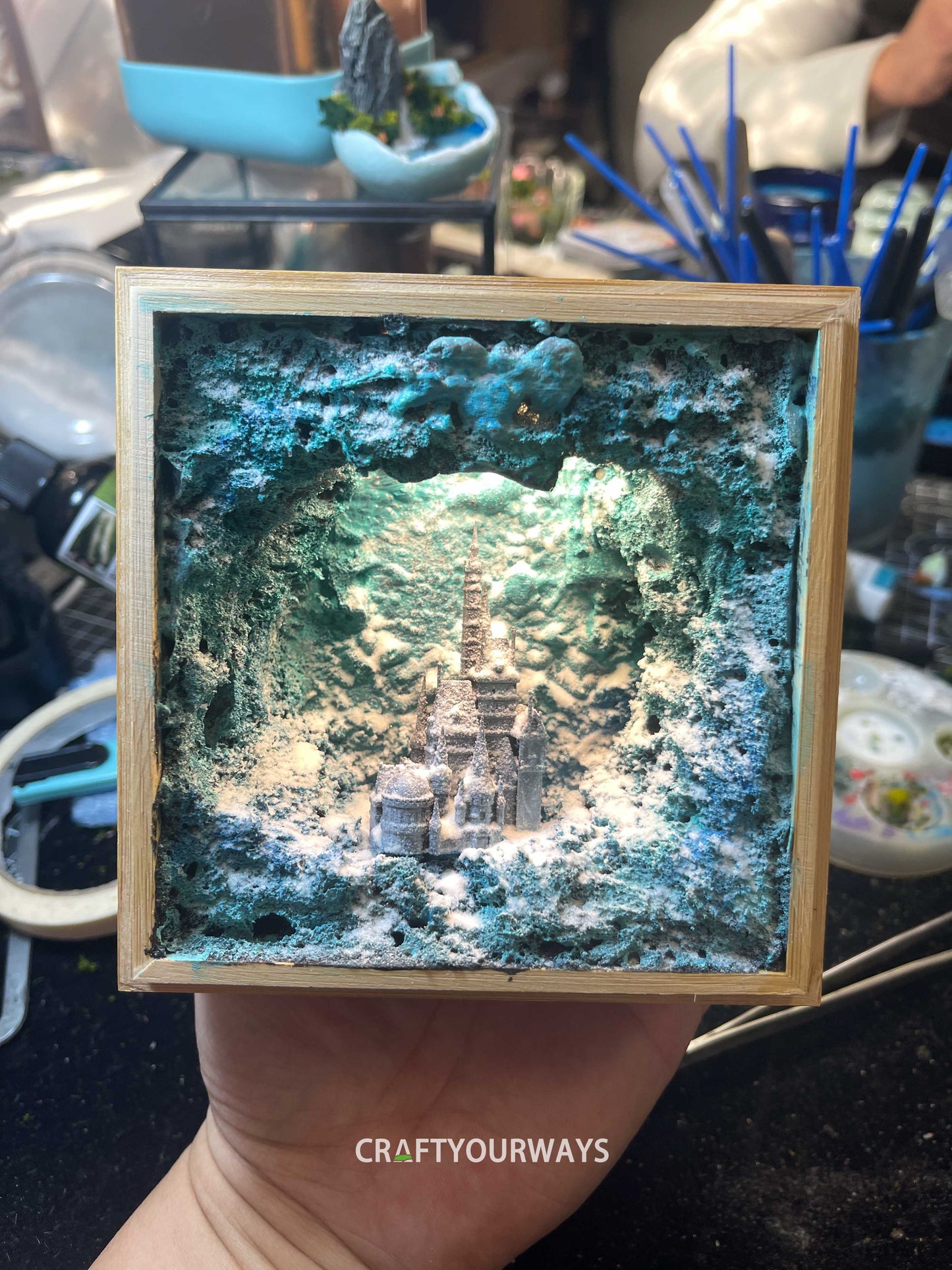 Miniature Castle in Snowy Cave with Illuminated Interior