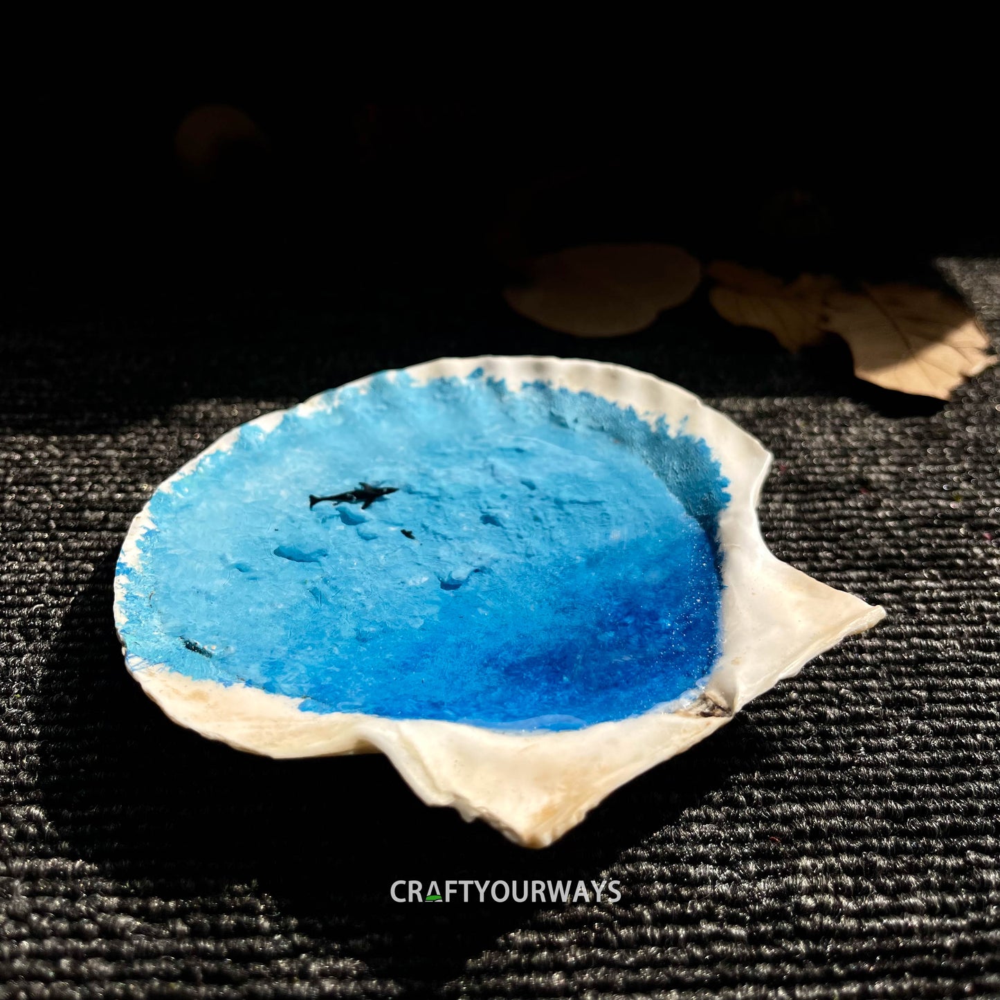 Miniature Whale Swimming in Ocean Inside Scallop Shell