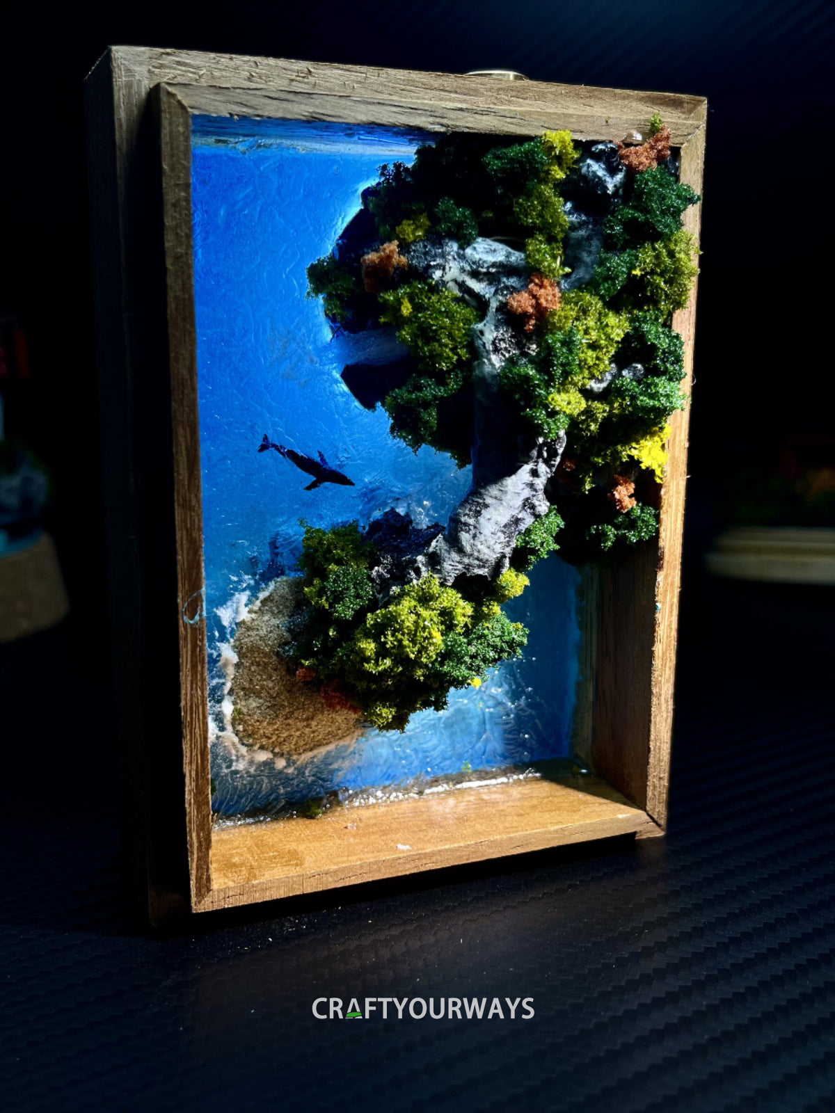 Miniature Coastal Scene of Whale Swimming Through a Natural Bridge