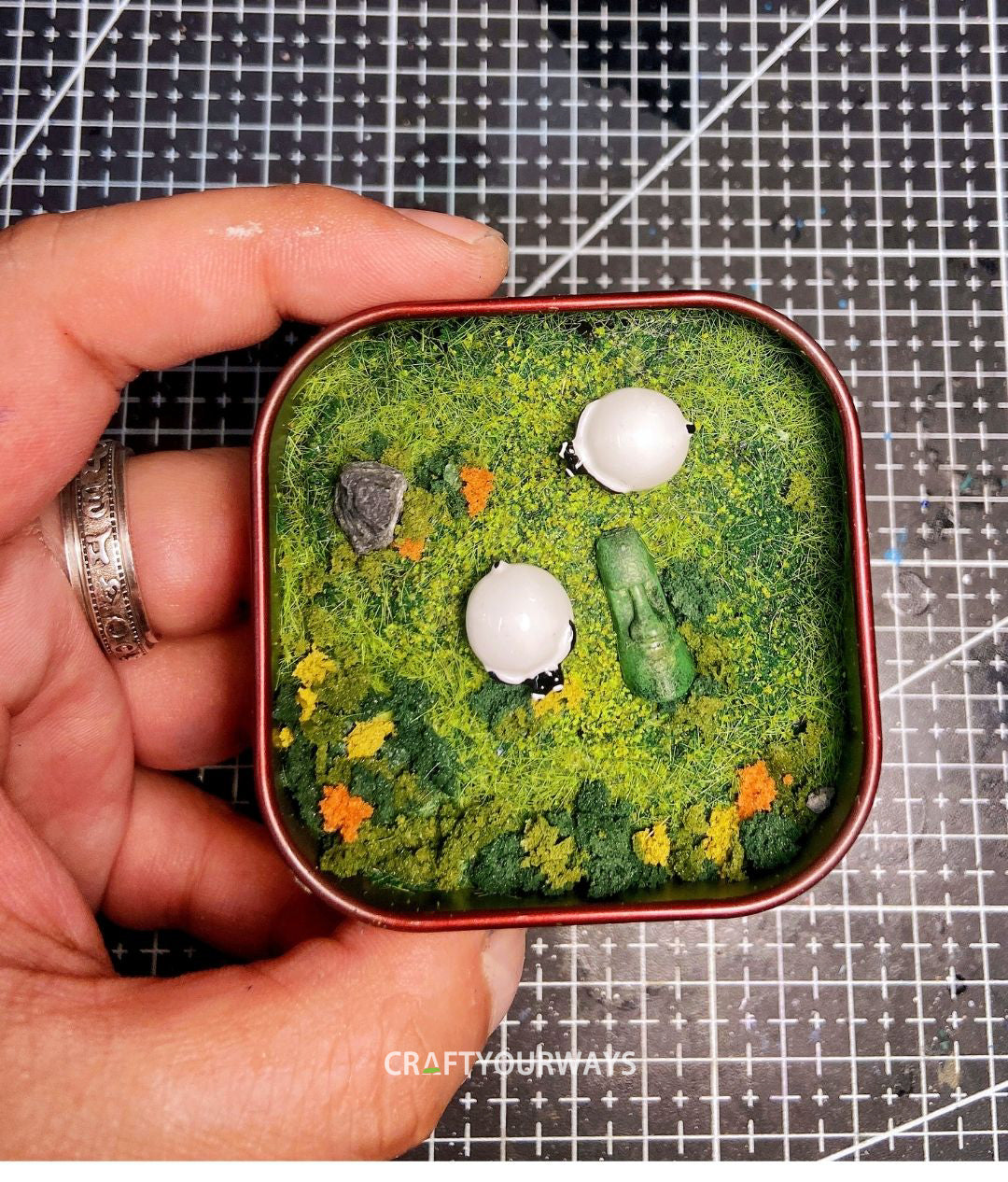 Miniature Resurrected Figure with Grazing Sheep in Tin Box